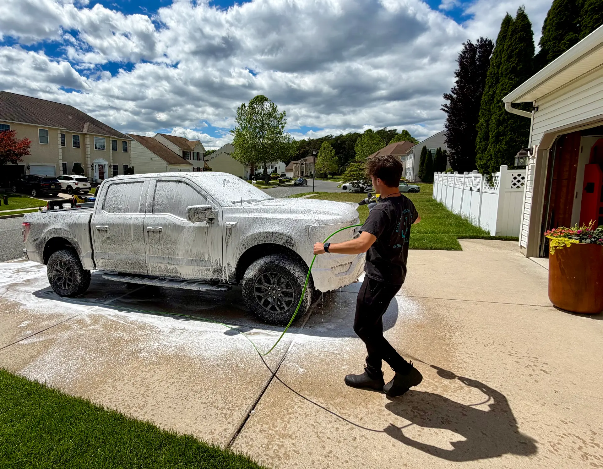 Blue Anchor Detailing — foaming a pickup during a mobile driveway detail